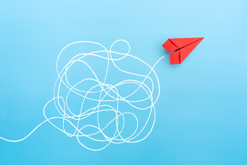 Wall Mural - Business for solution concept. red paper plane on blue background