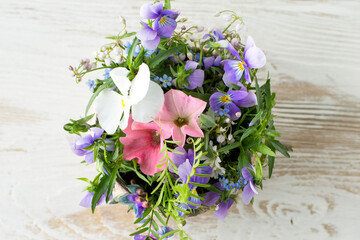 Wall Mural - flat lay of composition of summer flowers on a light background