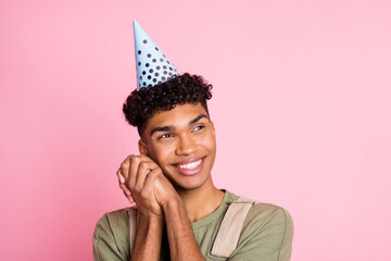 Wall Mural - Photo portrait of african american dreamy man looking at blank space isolated on pastel pink colored background