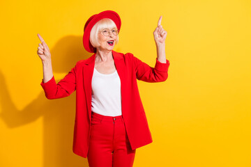 Sticker - Photo portrait of senior woman wearing red suit headwear enjoying music singing dancing isolated vivid yellow color background