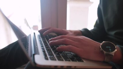 Fototapete - The man's hands are pressing the buttons of the computer keyboard. Creation of digital programming code. Skill of typing.