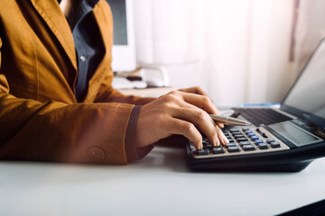 Digital marketing media in virtual screen.businesswoman hand working with mobile phone and modern compute with VR icon diagram at office in morning light