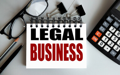 LEGAL BUSINESS. text on white paper on gray background