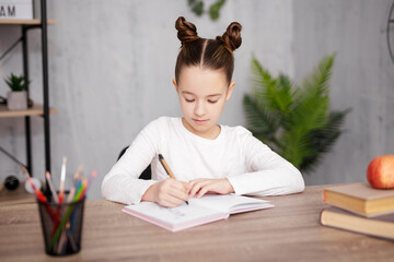 Wall Mural - school, homework and education concept - school girl doing homework at home