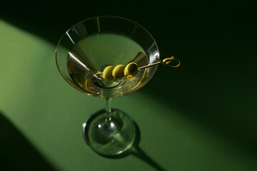 Glass of classic dry martini cocktail with olives