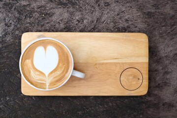 Sticker - Coffee latte art milk foam and cup on wood background