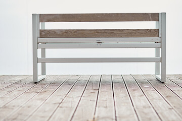 Empty bench on the terrace overlooking the sea on a cloudy day