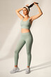 © Rawpixel.com - Woman in green sports bra and yoga pants activewear apparel full body