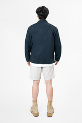 Wall Mural - Man in navy jacket and shorts streetwear rear view