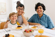© (JLco) Julia Amaral - Beautiful family at breakfast table