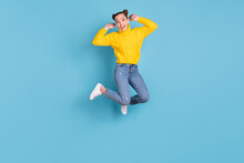 Full Size Photo Of Cheerful Carefree Person Jumping Hands Checking Hair Isolated On Blue Color Background