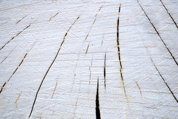 A cracked old white wooden board in close-up.Texture or background