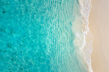 Top View On Coast Waves On Beach Aerial View, Crystal Clear Water. Stunning Summer Landscape, Sunny Tropical Island Shore. Seaside, Idyllic Nature Earth View. Stunning Scenery, Amazing View