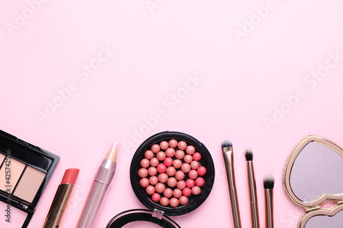 Obraz Dibond Flat lay composition with makeup products on pink background, space for text