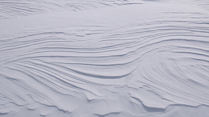 Wall Mural - curved lines and layers in pure white snow abstract textured background