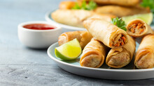 Fried Spring Rolls With Sweet Chili Sauce And Lime On Plate