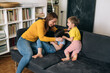 © cherryandbees - mother playing with her kids at home