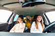© F8  \ Suport Ukraine - Three women driving in a convertible car and having fun