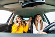 © F8  \ Suport Ukraine - Young three women returning from the shopping. Young girls riding car and returning from shopping.