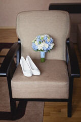 Wall Mural - Wedding accessories in classic blue color: Bride's shoes, rings, boutonniere and wedding bouquet