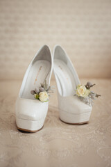 Wall Mural - Wedding accessories: bride's shoes, rings and boutonniere