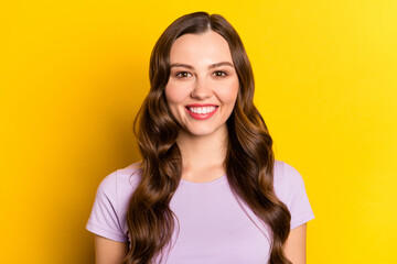 Poster - Portrait of attractive cheerful wavy-haired girl good mood isolated over vibrant yellow color background