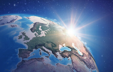 Wall Mural - sunrise through clouds, upon a high detailed satellite view of planet earth, focused on western euro