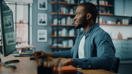 Poster - Handsome Black African American Specialist Working on Desktop Computer in Creative Home Living Room. Freelance Male is Working on a Finance Presentation Report for Clients and Employer.