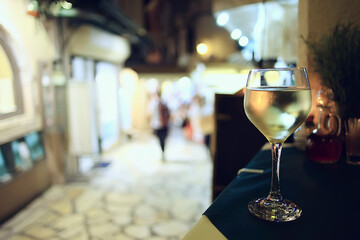 glass white wine restaurant interior, abstract evening dinner with alcohol at the bar