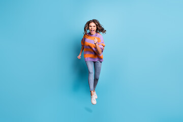 Canvas Print - Full length portrait of astonished running fast girl open mouth shout isolated on blue color background