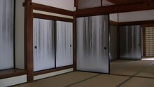 Pan Of Interior Of Japanese House With Painted Fusuma To View Of Garden.