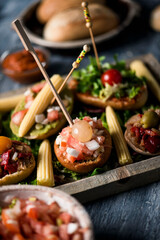 Sticker - different vegan spanish pinchos in a tray