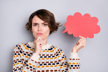 Sticker - Portrait of pretty pensive sullen girl holding in hand paper cloud shape overthinking isolated over grey pastel color background