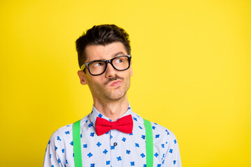 Poster - Photo of young handsome man think thoughtful guess wonder minded look empty space isolated over yellow color background