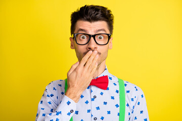 Sticker - Photo of young man nervous panic worried oops mistake fail cover lips hand isolated over yellow color background