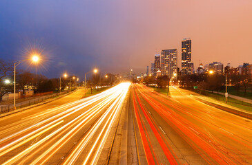 Chicago skyline after sunset showing Chicago downtown with car tail lights. Chicago, on Lake Michigan in Illinois, is among the largest cities in the U.S. 