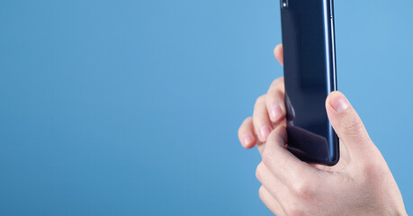 Man taking a picture with smartphone.