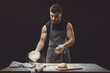 © Nataliya Schmidt - The chef prepares the pizza dough