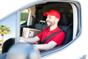 Wall Mural - Delivery man en route to making parcel deliveries