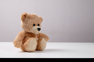 teddy bear on a white table in the office