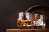 Fototapeta Tulipany - Scotch whiskey glass and old barrel