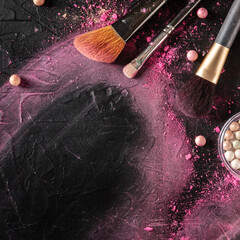 Wall Mural - Make up brushes and pearls, top shot on a dark background