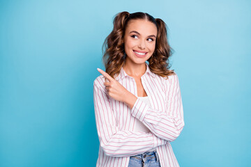 Sticker - Photo portrait curious dreamy girl smiling showing finger looking blank space isolated vivid blue color background