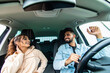 © F8  \ Suport Ukraine - Happy cheerful indian couple having fun while sitting in a car