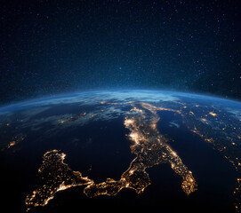 Poster - Beautiful blue planet earth with night city lights. Central Europe and Italy at night view from space. Modern cities and electricity