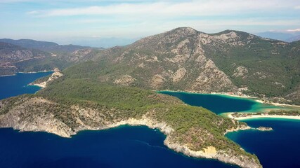 Wall Mural - Aerial view of blue lagoon in Oludeniz, Turquoise Coast of southwestern, Fethiye district Turkey. Sunny summer day with clear blue sky. Aerial view 4K.