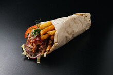 Greek Gyros Wrapped In Pita Breads On Black Background. Gyro Pita, Shawarma, Take Away, Street Food