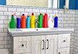 Detergent bottles and detergent spray cleaner in the bathroom on washbasin. Household for cleaning and washing. Concentrated and anti-bacterial liquids for dishwasher. Detergents and laundry concept