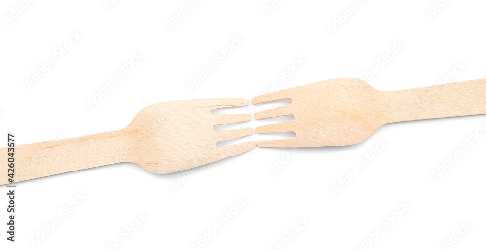 Wooden forks on white background