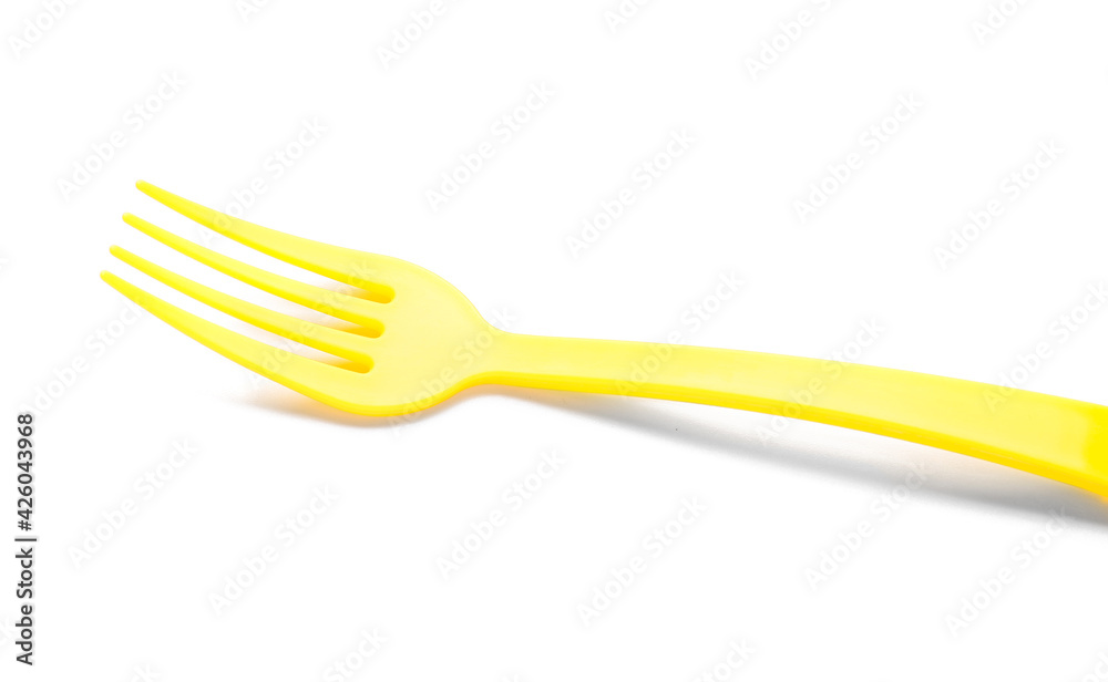Plastic fork on white background